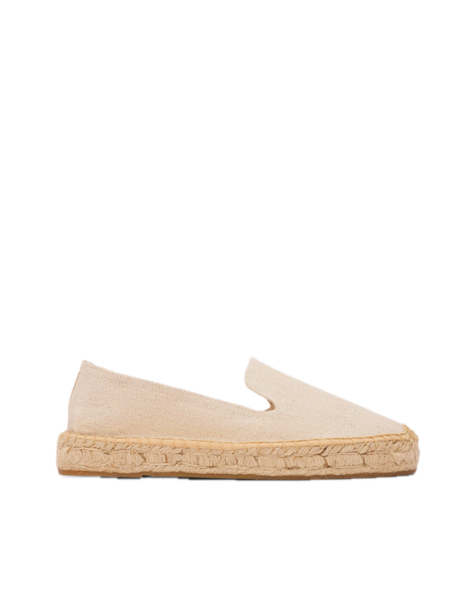 A natural undyed basketwoven cotton slip-on espadrille on a jute platform sole.